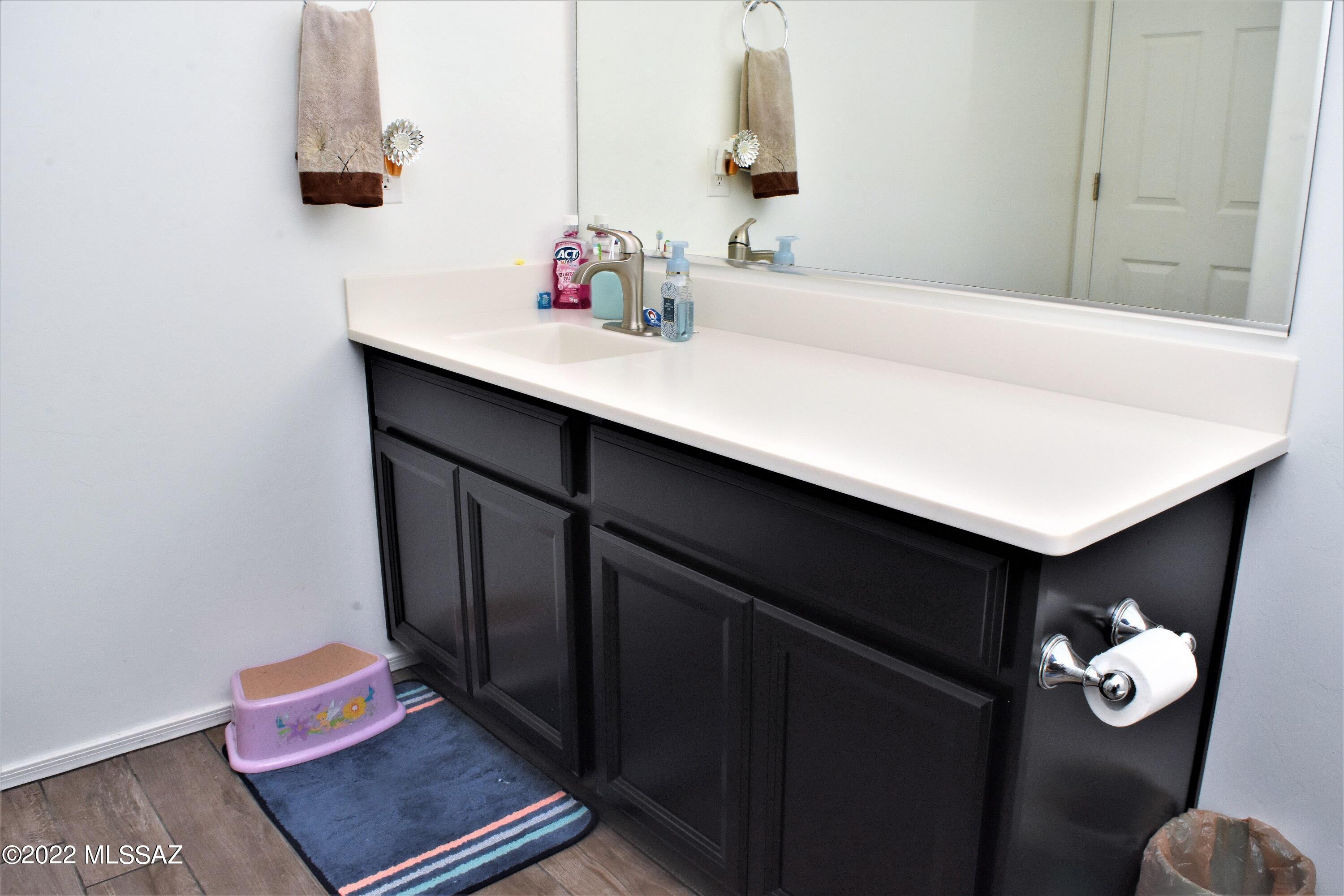 21295 East Treasure Road Red Rock, AZ 85145 - Photo 20 of 34 a bathroom with a sink and a mirror