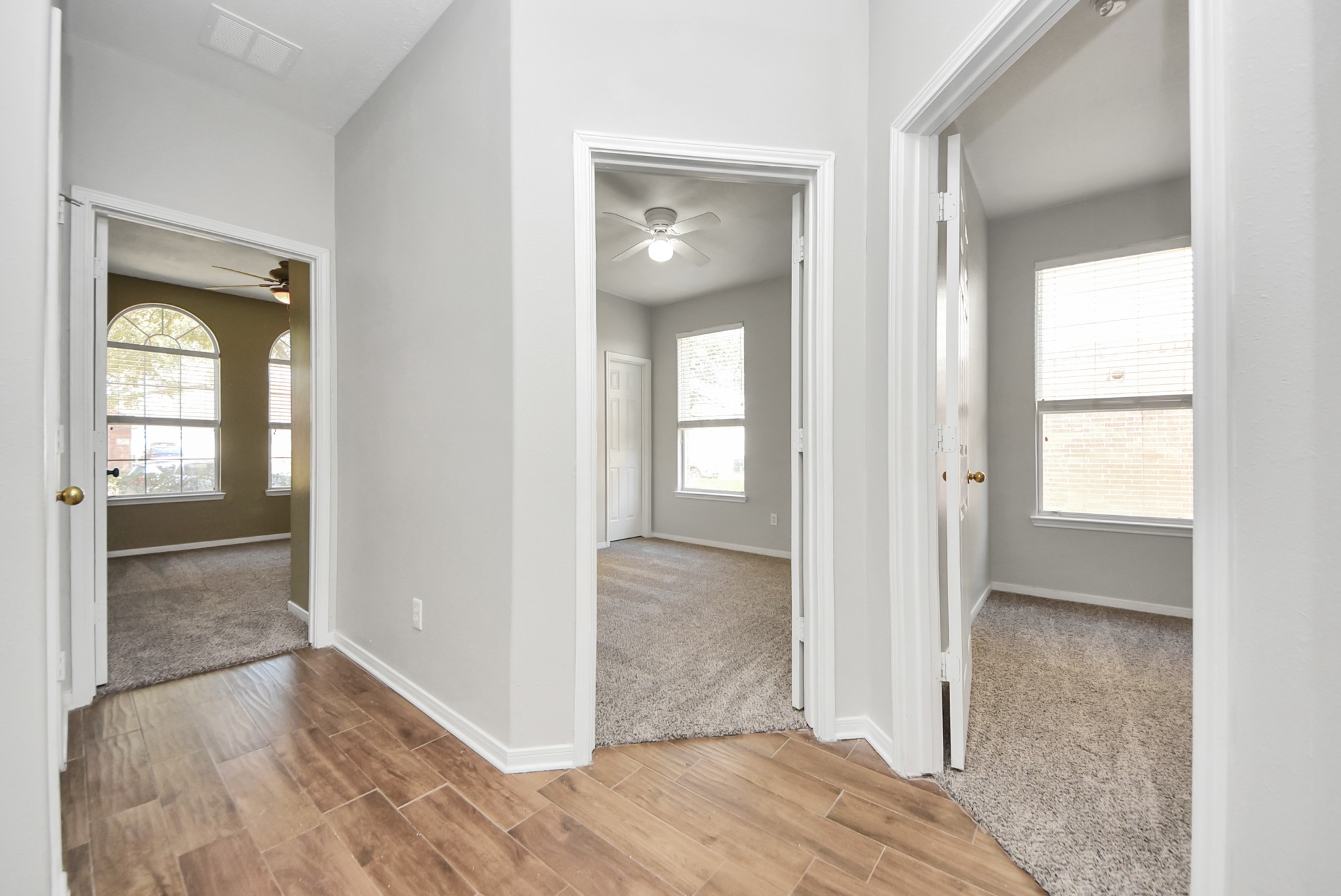 2306 2 Trail Drive Spring, TX 77373 - Photo 20 of 27 Bright hallway with wooded flooring leading to 3 Guest rooms.