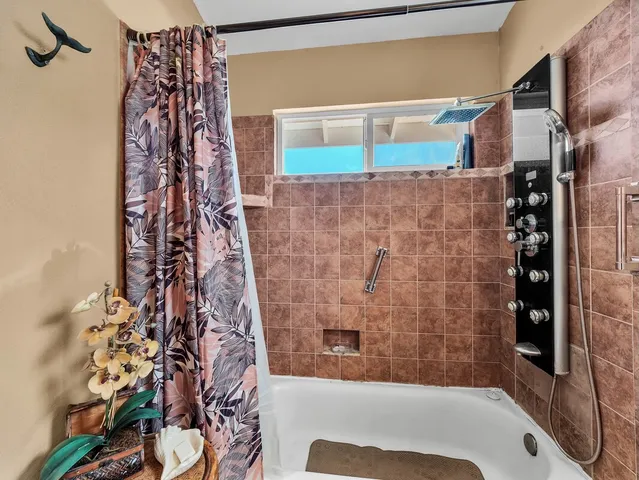 a view of a room with a table and chairs