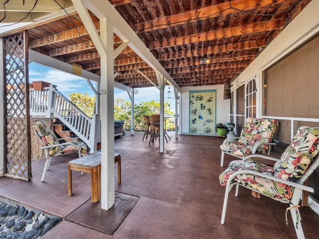 a view of a balcony with furniture