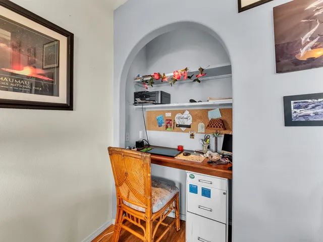 a view of a livingroom with furniture and a flat screen tv
