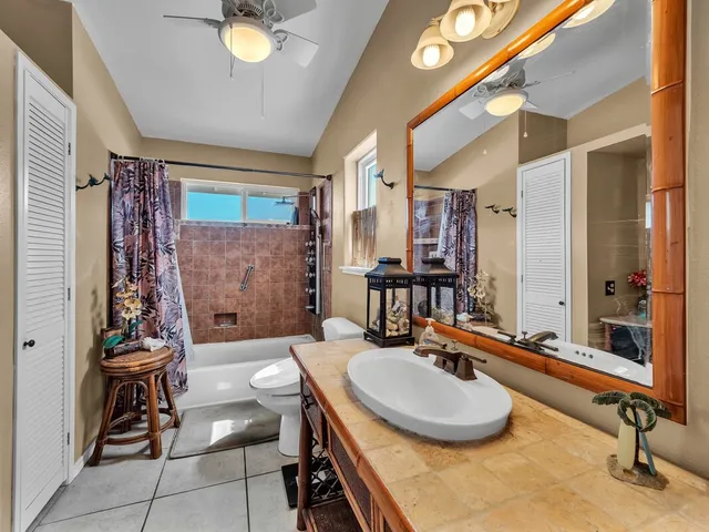 a bathroom with a bathtub and shower