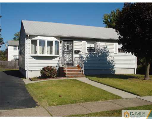 25 Rector Avenue Woodbridge, NJ 07095 - Photo 1 of 14 a front view of a house with a yard