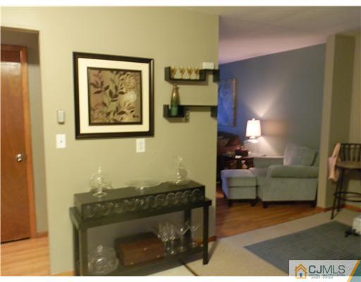 25 Rector Avenue Woodbridge, NJ 07095 - Photo 12 of 14 a living room with furniture and a fireplace
