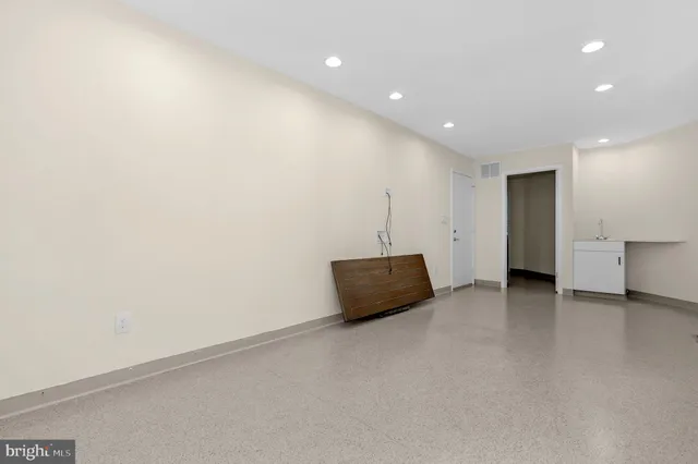 a kitchen with stainless steel appliances granite countertop a sink a stove and a microwave