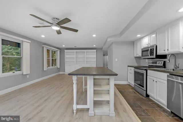 a view of a swimming pool with a yard