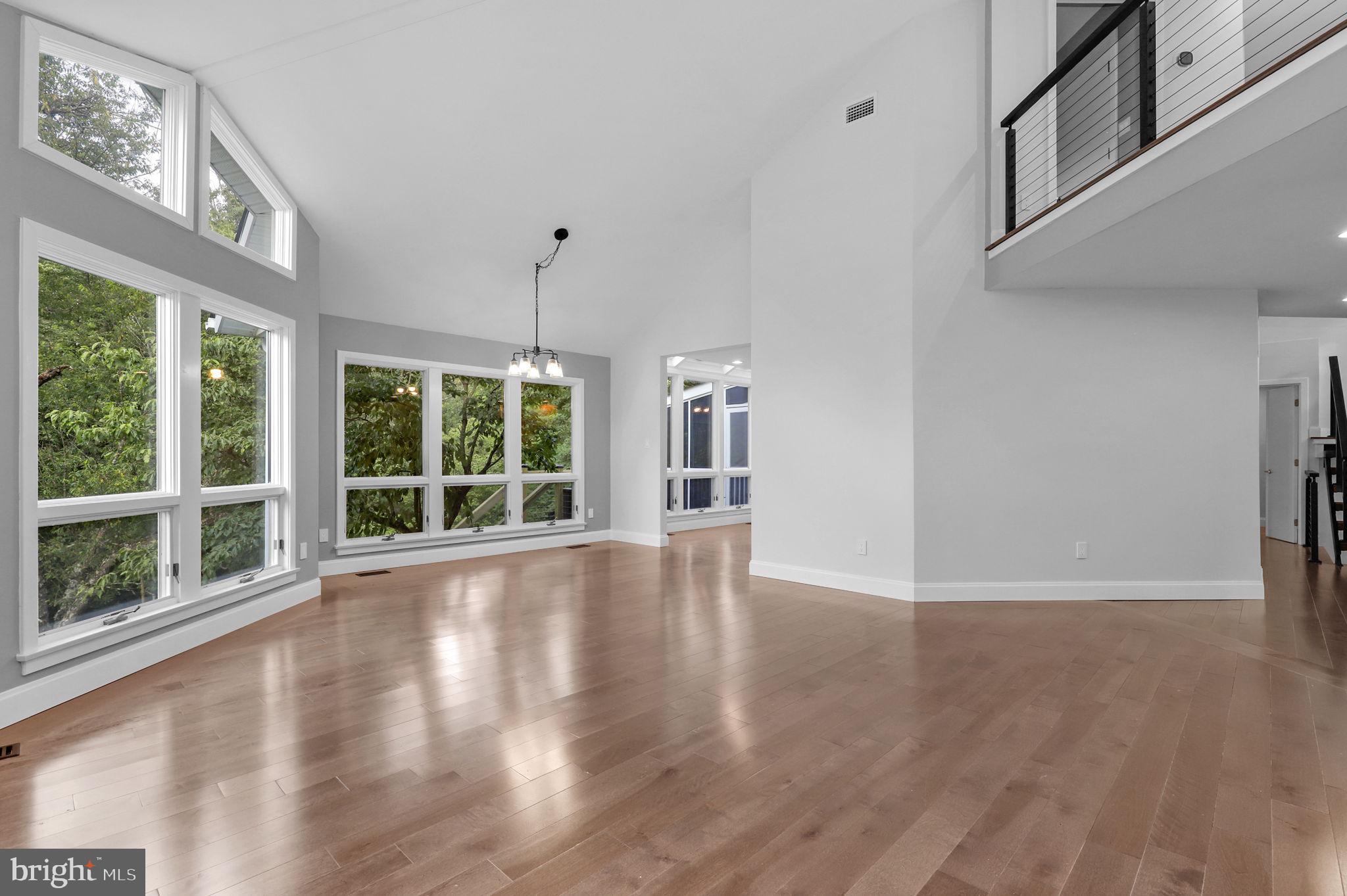 15606 Bushy Park Road Woodbine, MD 21797 - Photo 6 of 76 a view of an empty room with wooden floor and a window