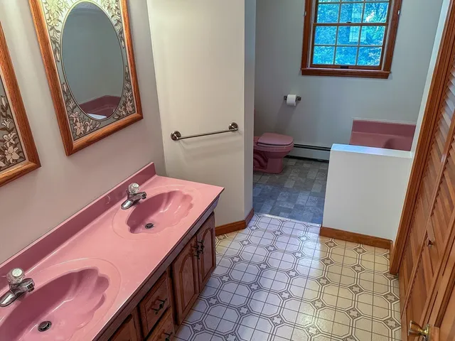 a bathroom with a toilet and a sink