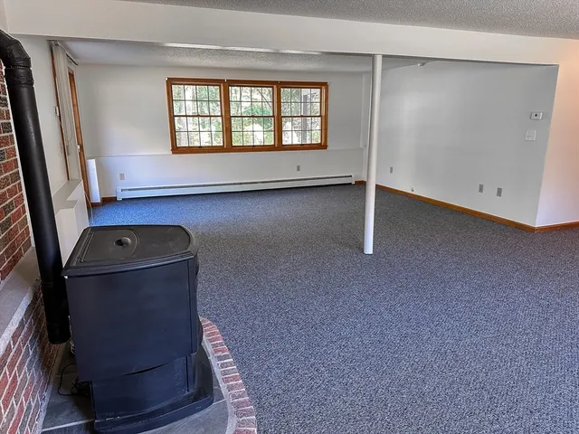 a room with gym equipment and view of living room