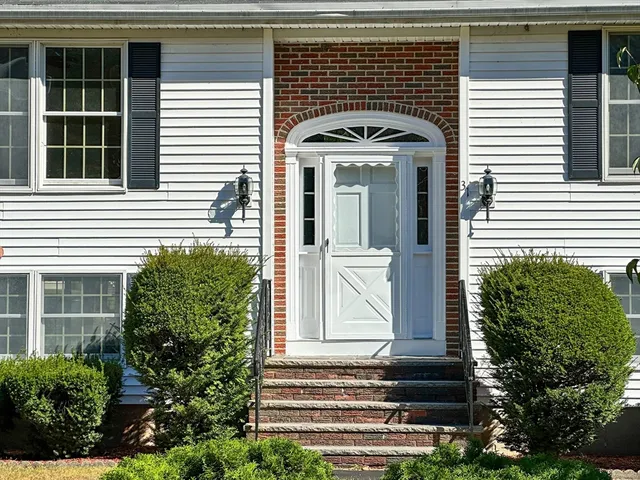 a front view of a house with a door