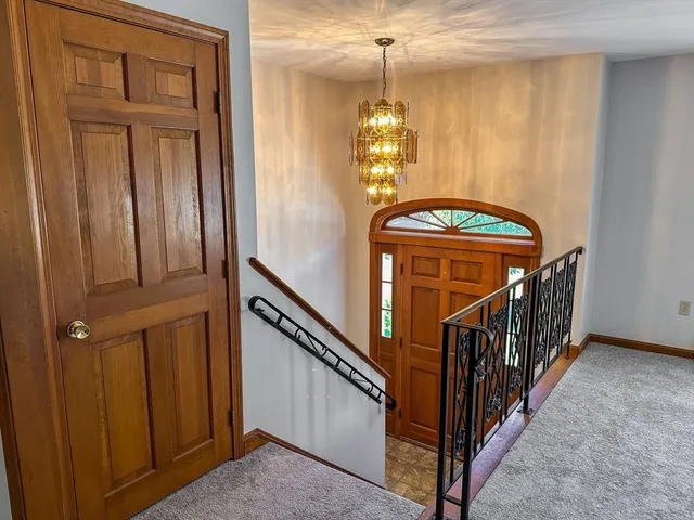 a view of a hallway with a door