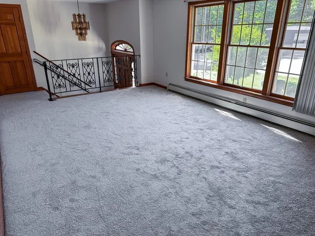 a view of an empty room with windows