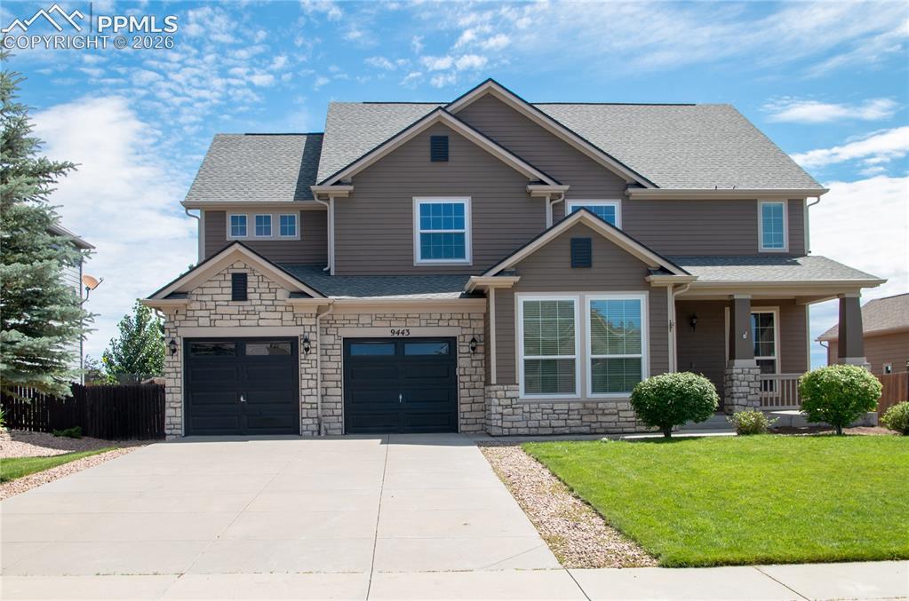 9443 St.George Road Peyton, CO 80831 - Photo 2 of 45 a front view of a house with garden