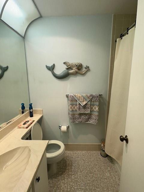 1985 Southwest 15th Street, Unit 126 Deerfield Beach, FL 33442 - Photo 14 of 27 a bathroom with a toilet and a sink