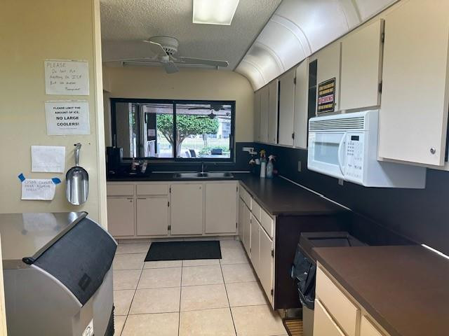 1985 Southwest 15th Street, Unit 126 Deerfield Beach, FL 33442 - Photo 21 of 27 a kitchen with a sink and cabinets