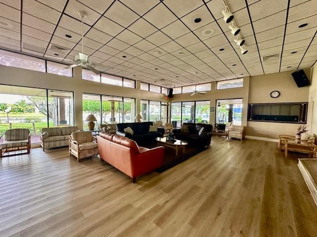 1985 Southwest 15th Street, Unit 126 Deerfield Beach, FL 33442 - Photo 25 of 27 a living room with furniture and a flat screen tv
