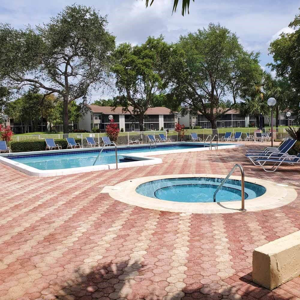 1985 Southwest 15th Street, Unit 126 Deerfield Beach, FL 33442 - Photo 27 of 27 a view of outdoor space yard and swimming pool
