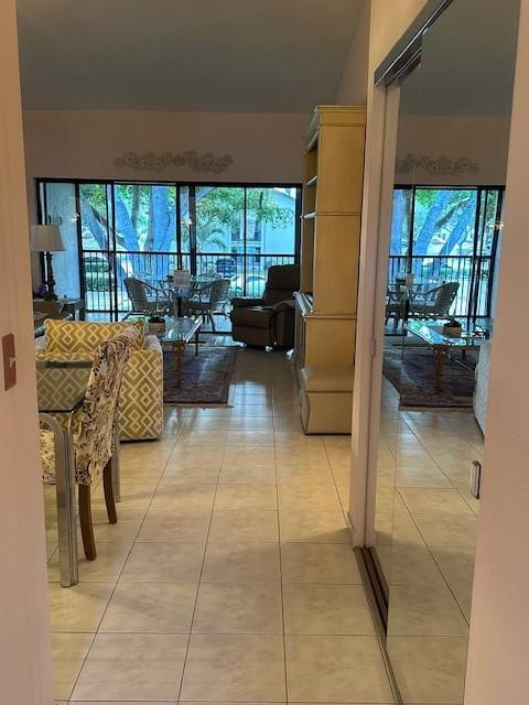 1985 Southwest 15th Street, Unit 126 Deerfield Beach, FL 33442 - Photo 3 of 27 a living room with furniture and a floor to ceiling window