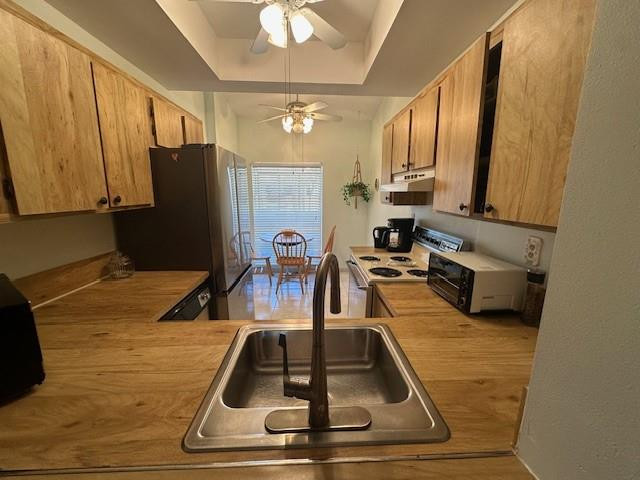 1985 Southwest 15th Street, Unit 126 Deerfield Beach, FL 33442 - Photo 7 of 27 a kitchen with sink refrigerator and cabinets