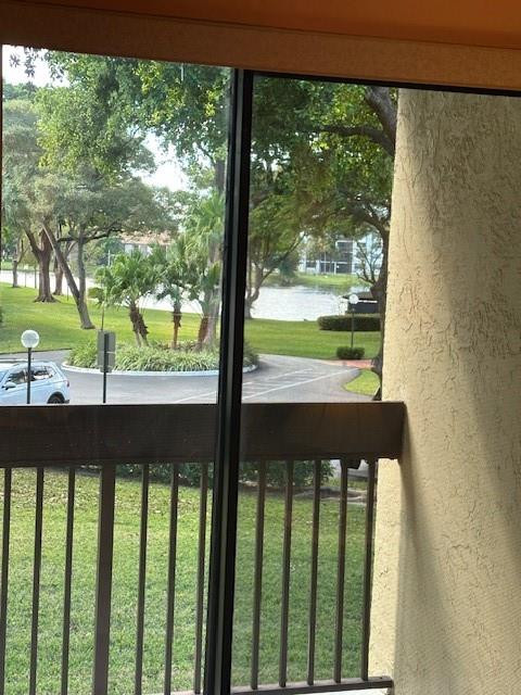 1985 Southwest 15th Street, Unit 126 Deerfield Beach, FL 33442 - Photo 10 of 27 a view of a balcony with an outdoor space and seating