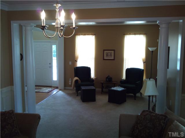 108 Riley Oaks Lane Apex, NC 27539 - Photo 11 of 22 Gorgeous Living Room Area with Columns that leads you into the Dining Area!