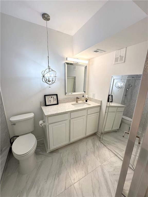 3823 Paces Ferry West Atlanta, GA 30339 - Photo 24 of 33 a bathroom with a toilet sink and mirror