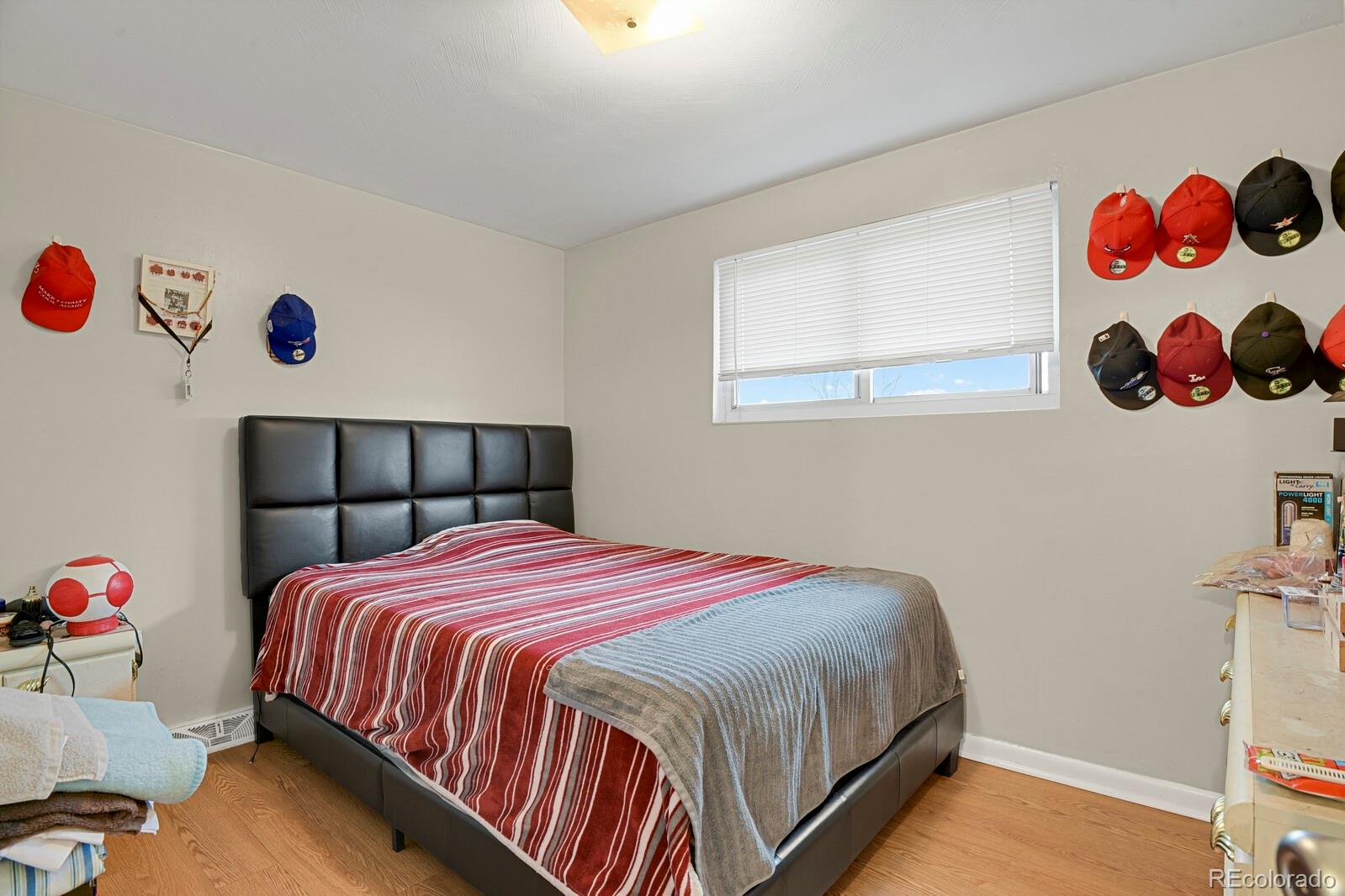 233 South Decatur Street Denver, CO 80219 - Photo 13 of 35 a bedroom with a bed and window