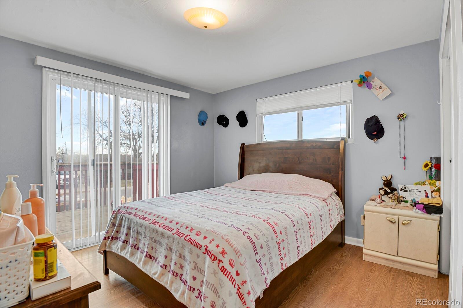 233 South Decatur Street Denver, CO 80219 - Photo 10 of 35 a bedroom with a bed and a window