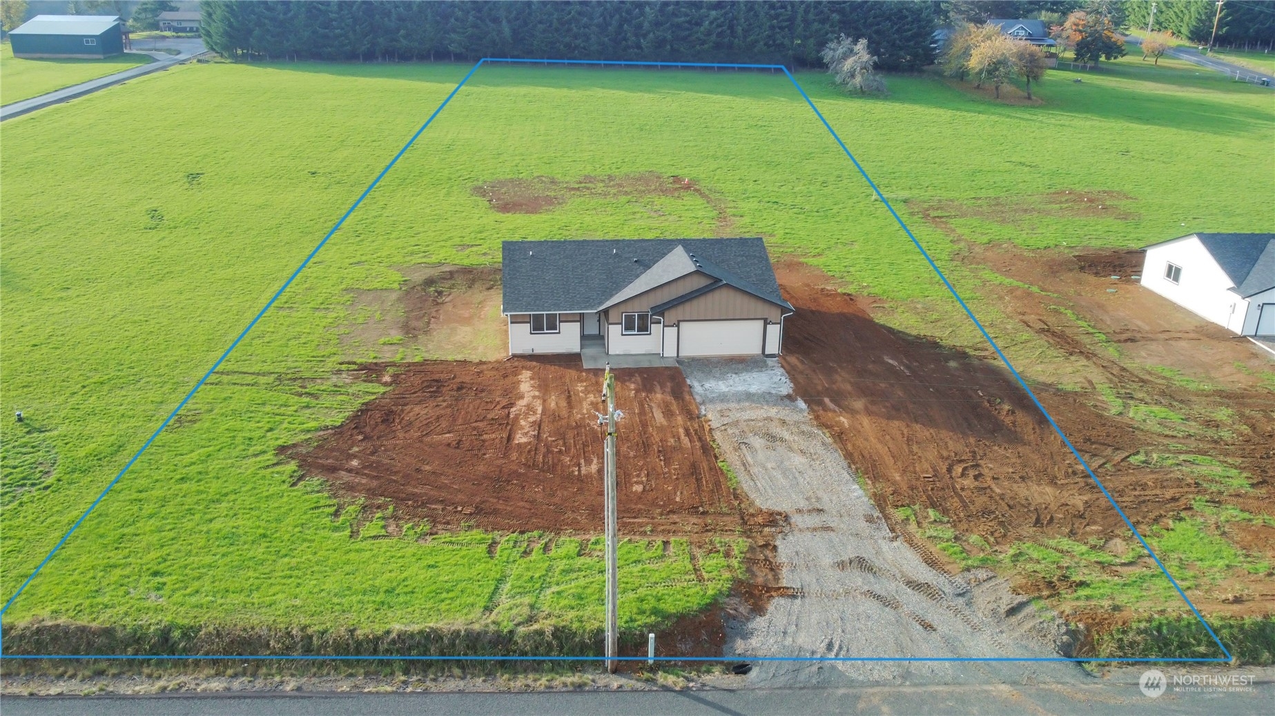 114 Gunnell Road Winlock, WA 98596 - Photo 2 of 23 a small yard with some trees in the background