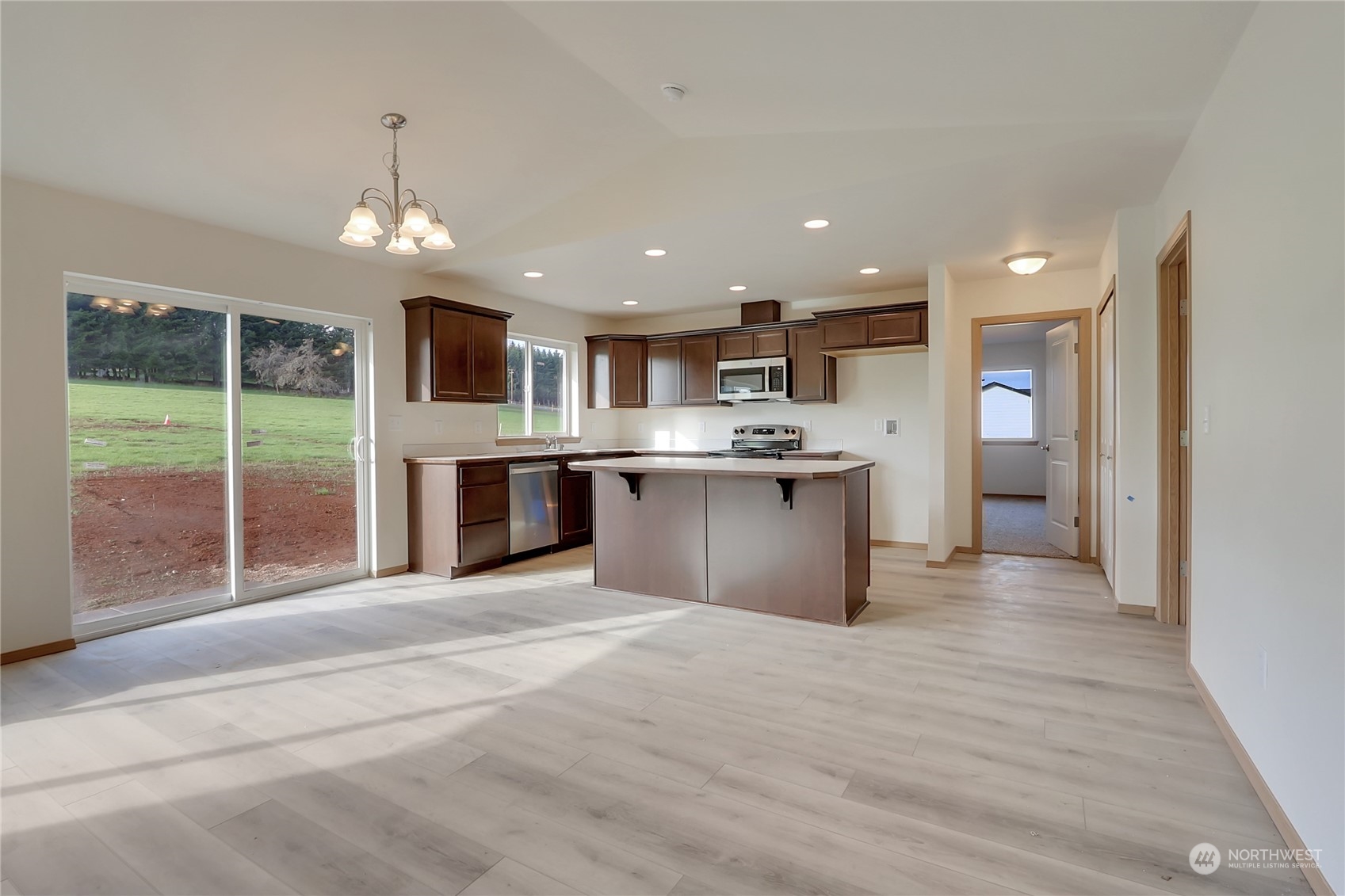 114 Gunnell Road Winlock, WA 98596 - Photo 7 of 23 a view of kitchen with granite countertop cabinets and refrigerator