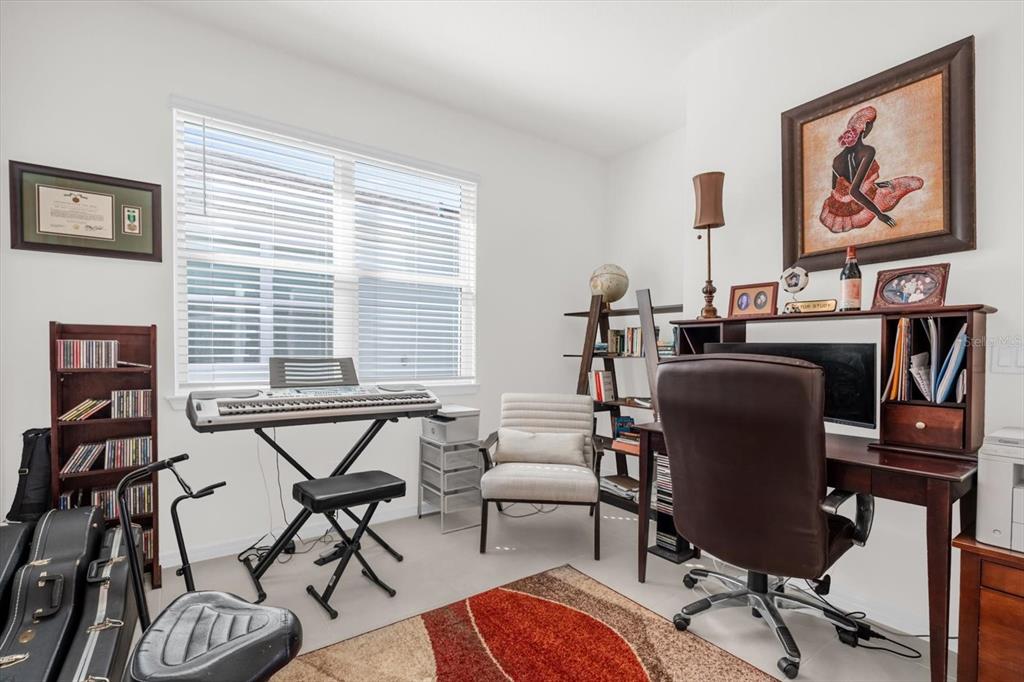 1911 Spring Shower Circle Kissimmee, FL 34744 - Photo 14 of 52 a view of a livingroom with furniture and a window