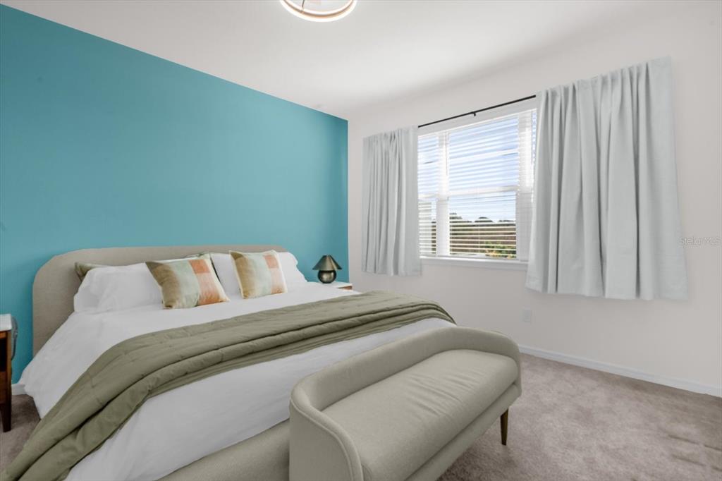 1911 Spring Shower Circle Kissimmee, FL 34744 - Photo 16 of 52 a bedroom with a bed and a window