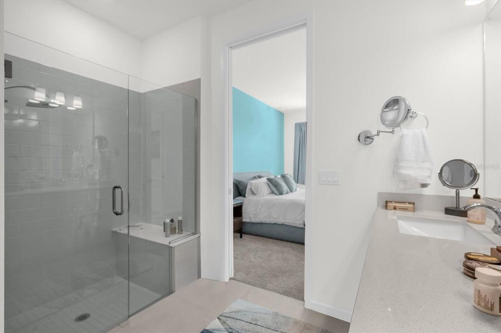 1911 Spring Shower Circle Kissimmee, FL 34744 - Photo 19 of 52 a en suite bathroom with a tub shower and sink