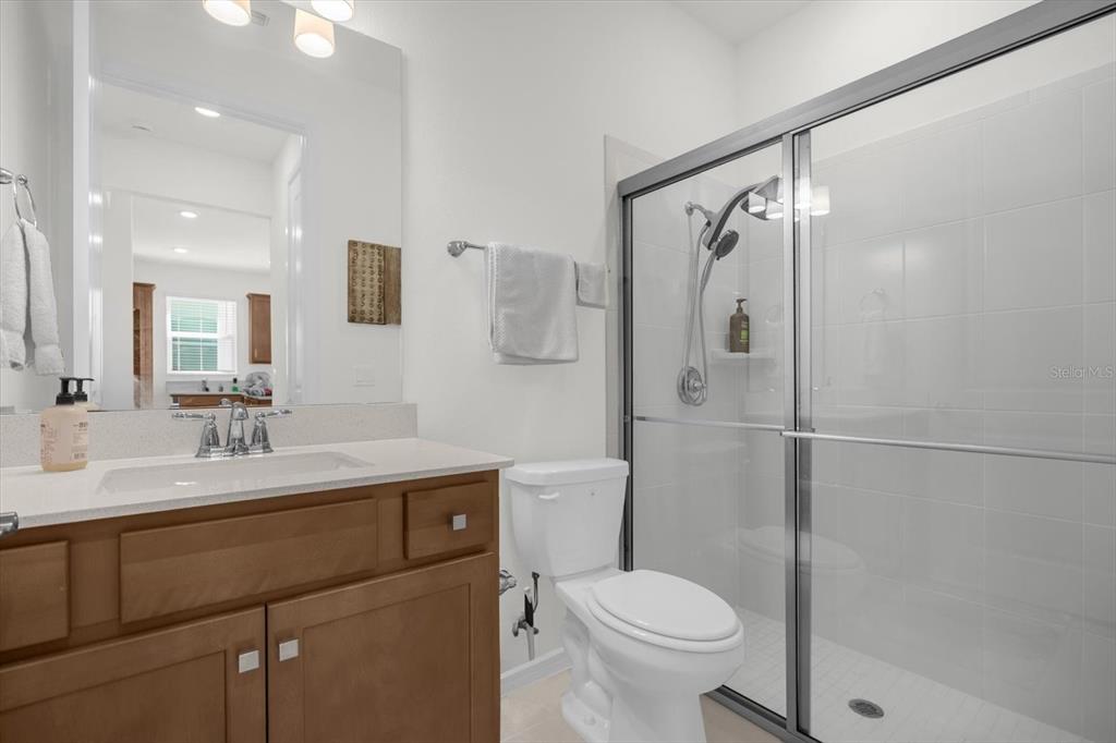 1911 Spring Shower Circle Kissimmee, FL 34744 - Photo 22 of 52 a bathroom with a sink toilet and shower