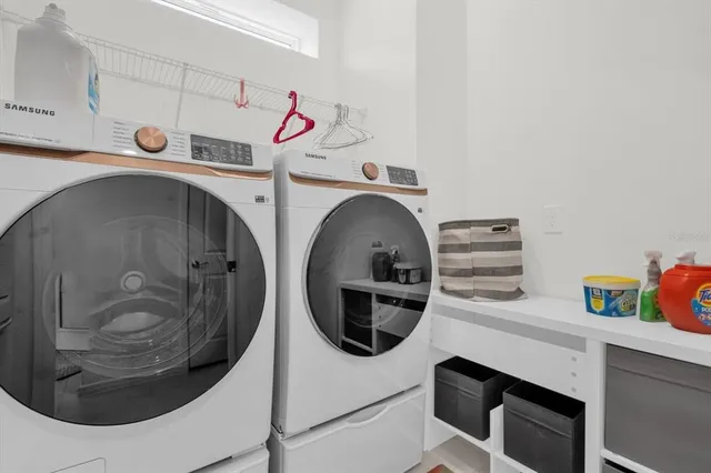 a utility room with dryer and washer