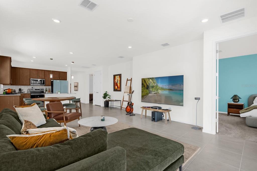1911 Spring Shower Circle Kissimmee, FL 34744 - Photo 3 of 52 a living room with furniture and a flat screen tv