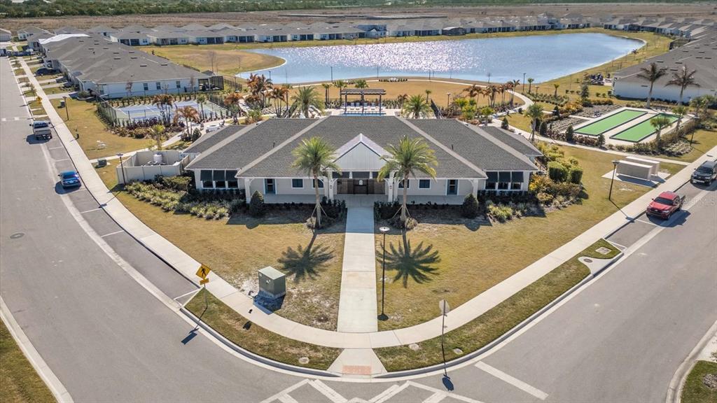 1911 Spring Shower Circle Kissimmee, FL 34744 - Photo 35 of 52 a view of a swimming pool with a lawn chairs under an umbrella