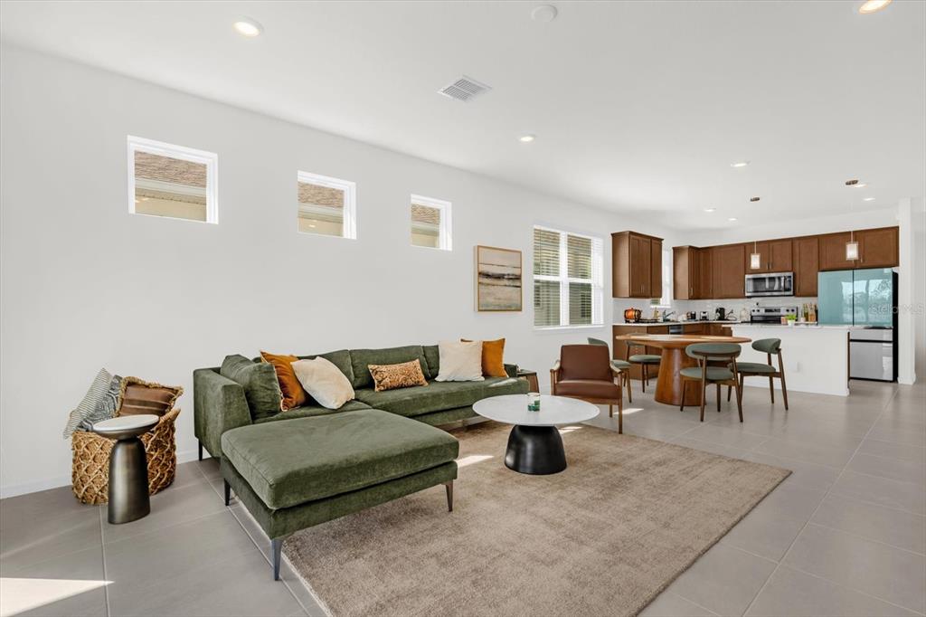 1911 Spring Shower Circle Kissimmee, FL 34744 - Photo 5 of 52 a living room with furniture and a table
