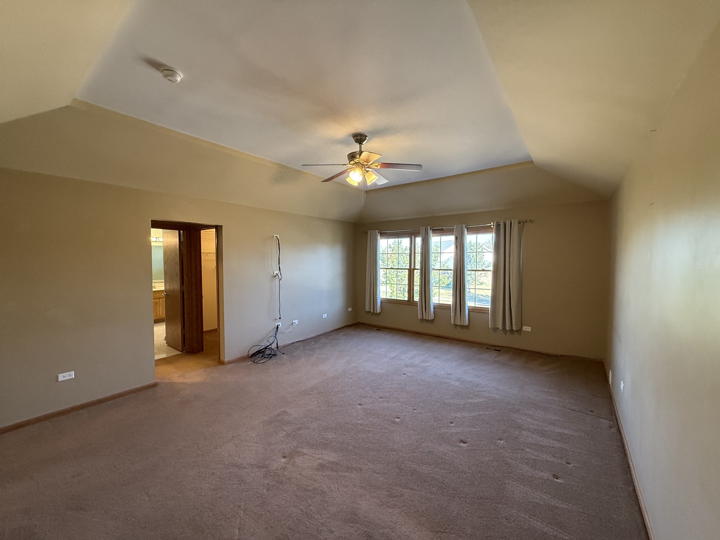 12457 Walden Road Homer Glen, IL 60491 - Photo 11 of 20 a view of a room with a ceiling fan and window