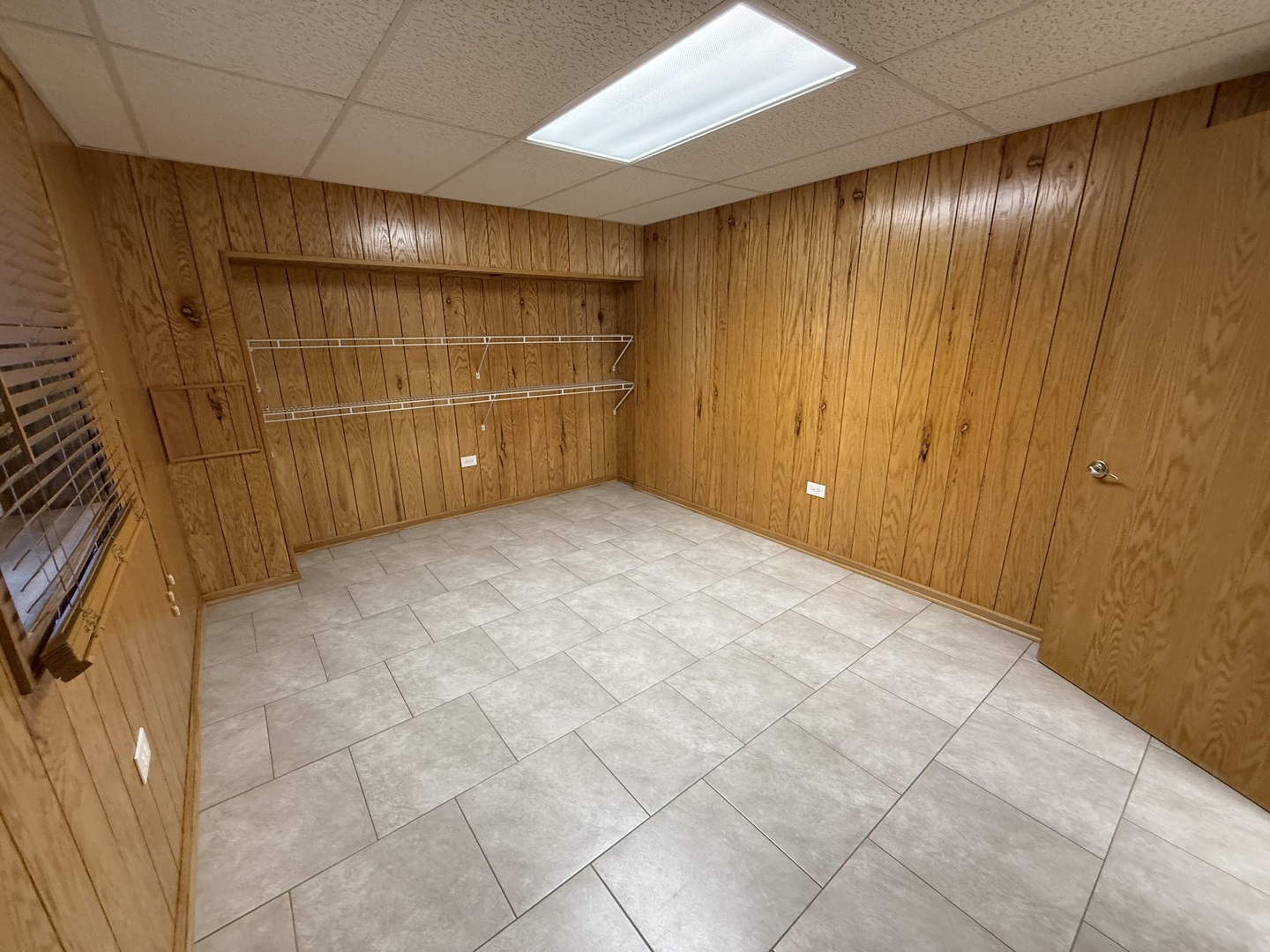 12457 Walden Road Homer Glen, IL 60491 - Photo 18 of 20 a view of an empty room with wooden walls