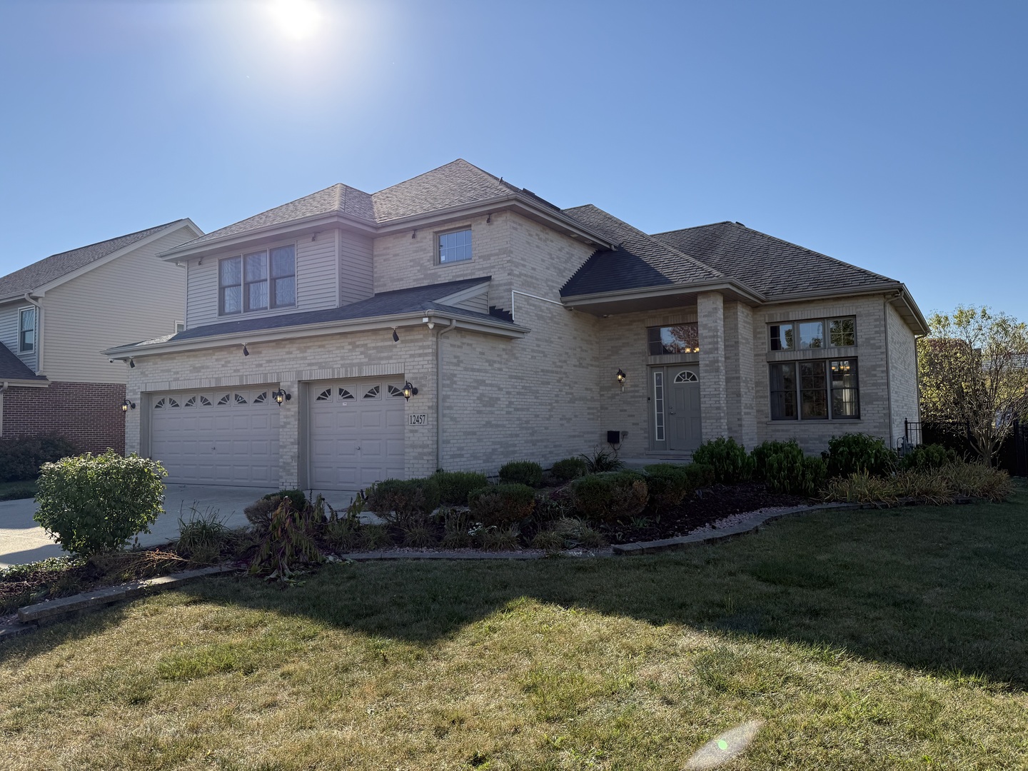 12457 Walden Road Homer Glen, IL 60491 - Photo 2 of 20 a front view of a house with a garden