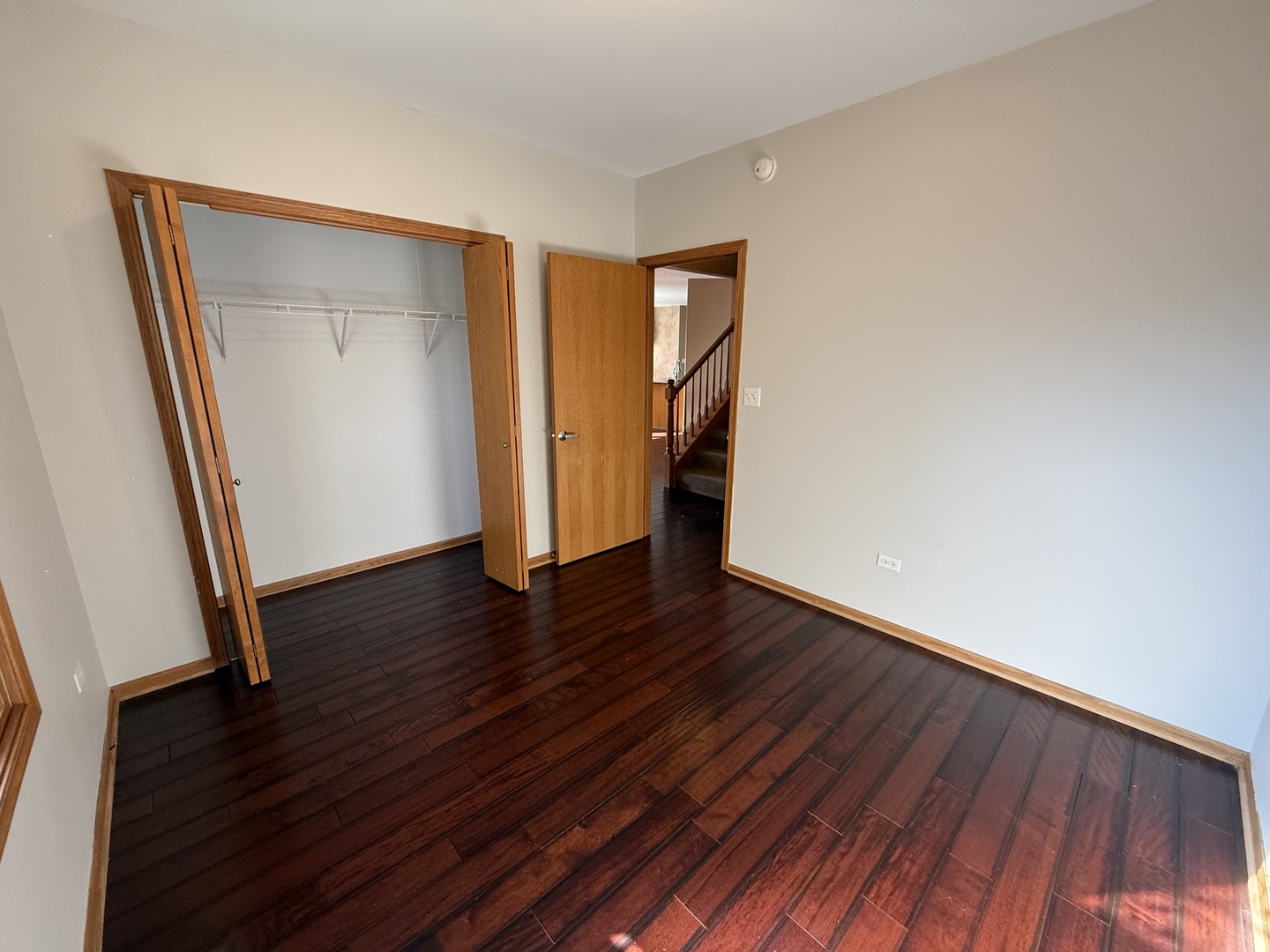 12457 Walden Road Homer Glen, IL 60491 - Photo 10 of 20 a view of an empty room with wooden floor and a window