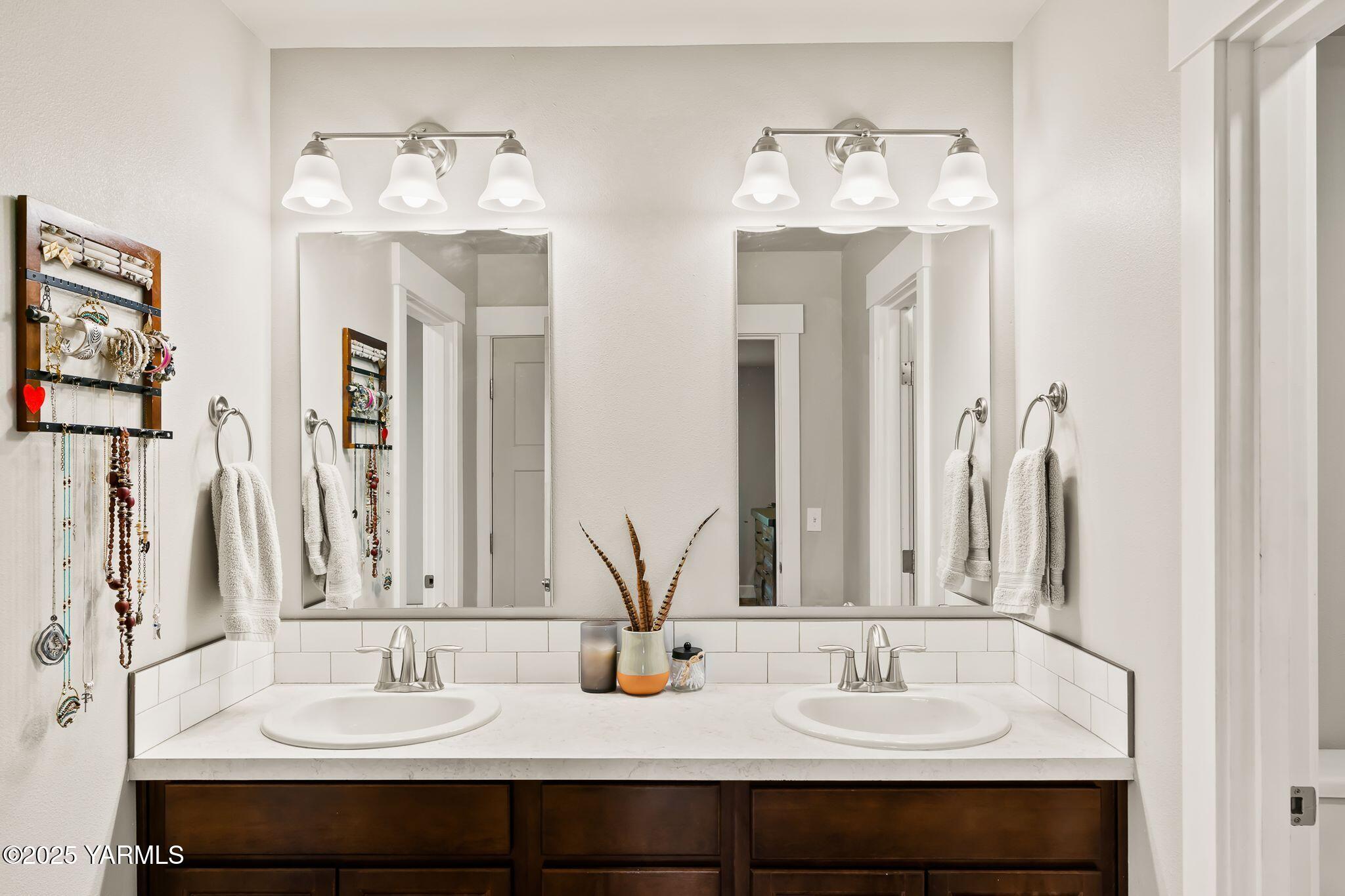 192 Sage Cove Road Yakima, WA 98903 - Photo 12 of 33 a bathroom with double vanity sinks a mirror and a window