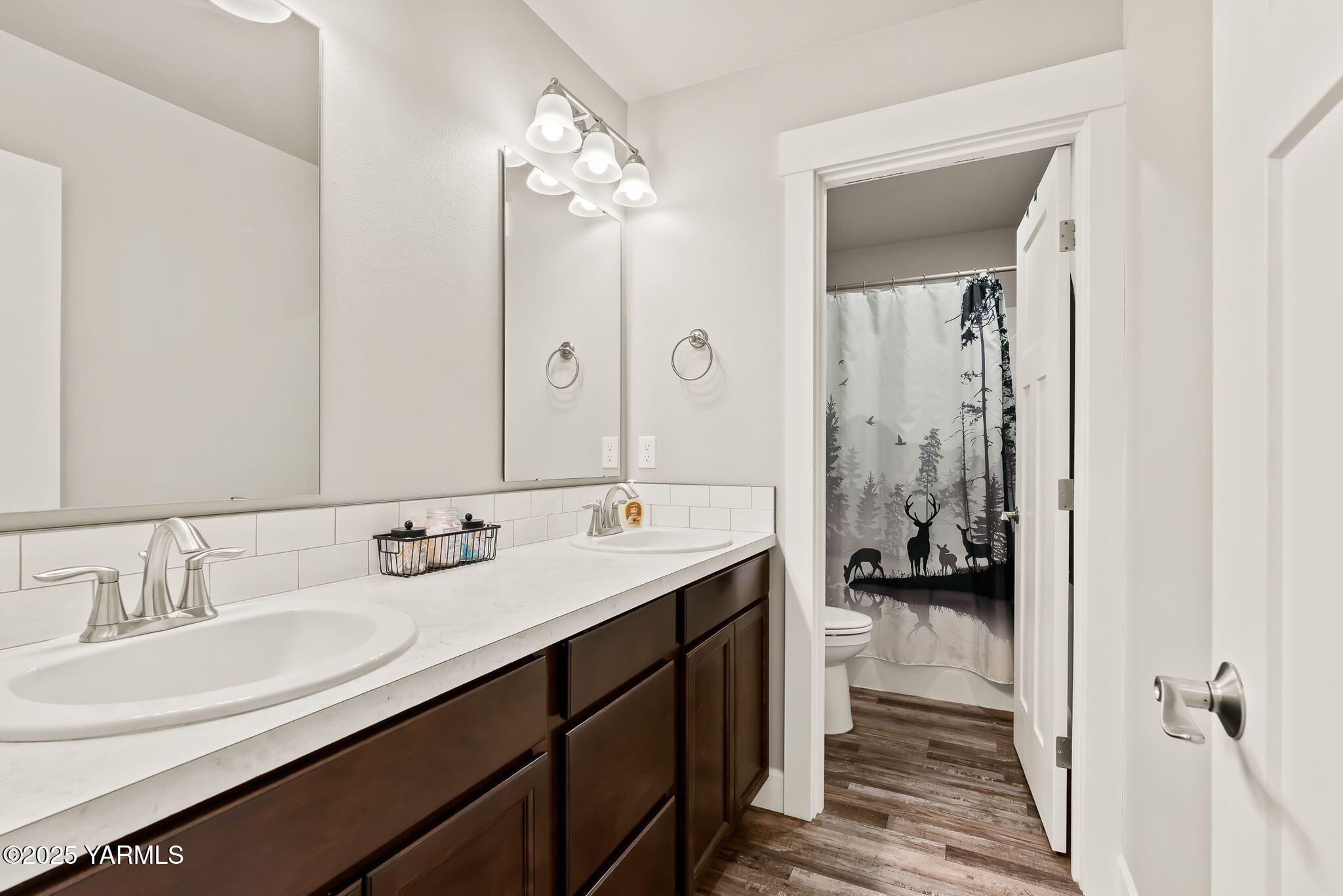 192 Sage Cove Road Yakima, WA 98903 - Photo 17 of 33 a en suite bathroom with a double vanity sink a mirror and shower