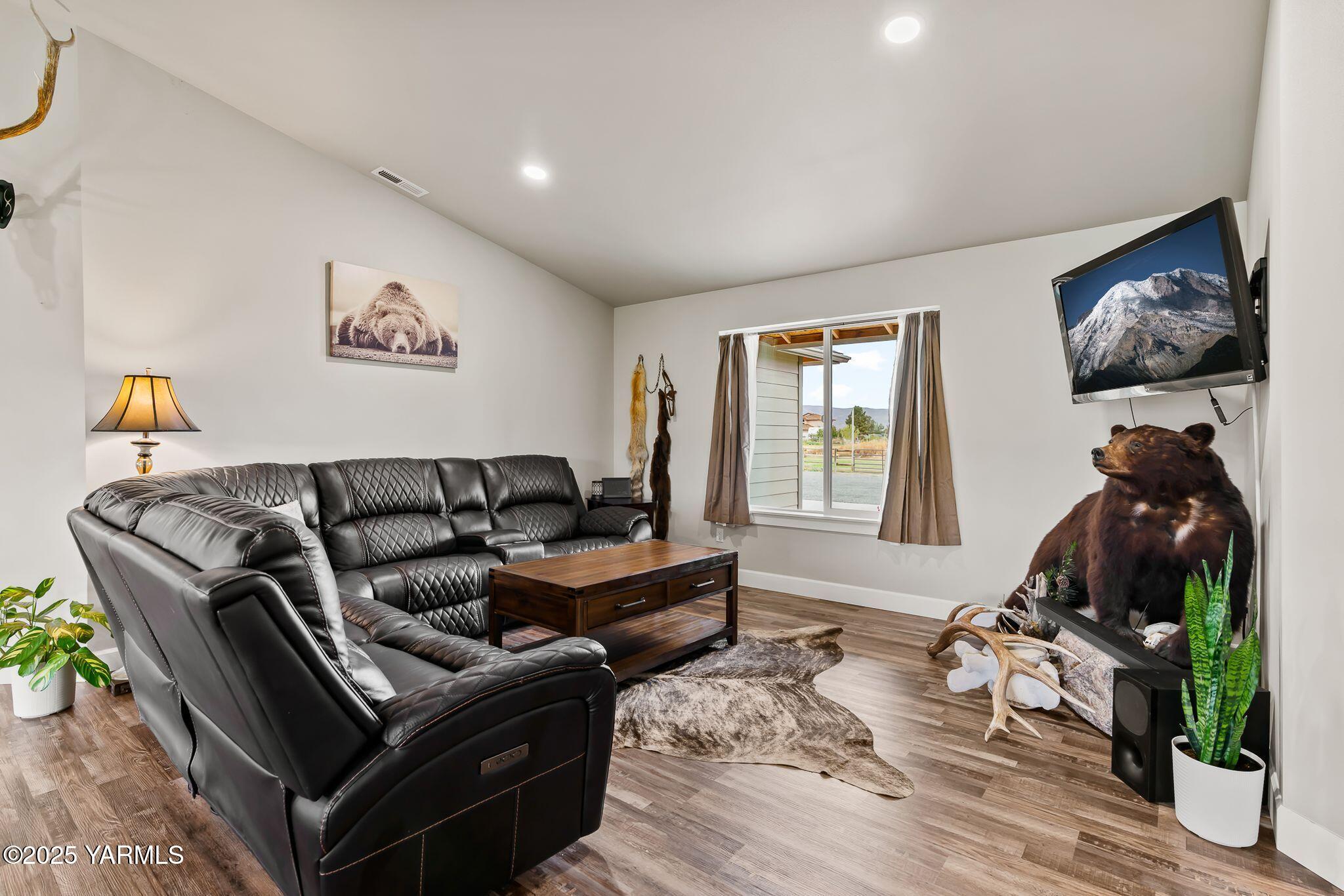 192 Sage Cove Road Yakima, WA 98903 - Photo 33 of 33 a living room with furniture two window and a flat screen tv