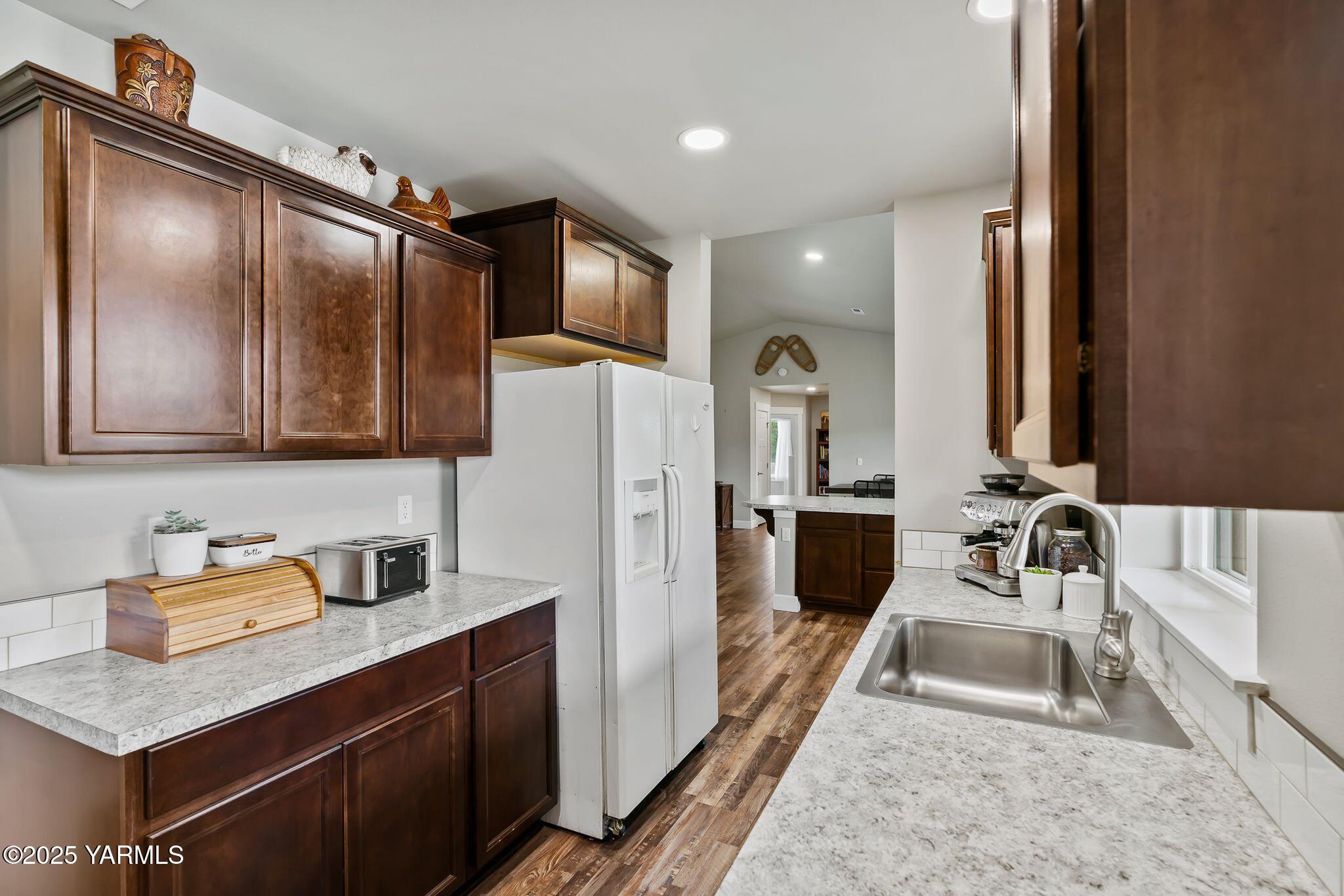 192 Sage Cove Road Yakima, WA 98903 - Photo 7 of 33 a bathroom with a sink a mirror and shower
