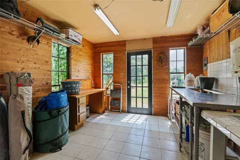 a kitchen that has a lot of cabinets in it