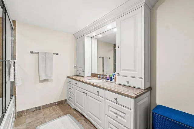 a bathroom with a double vanity sink and mirror