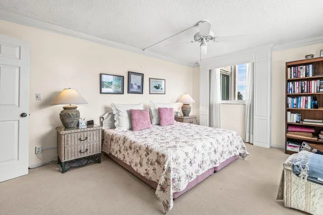 a bedroom with a bed and a book shelf