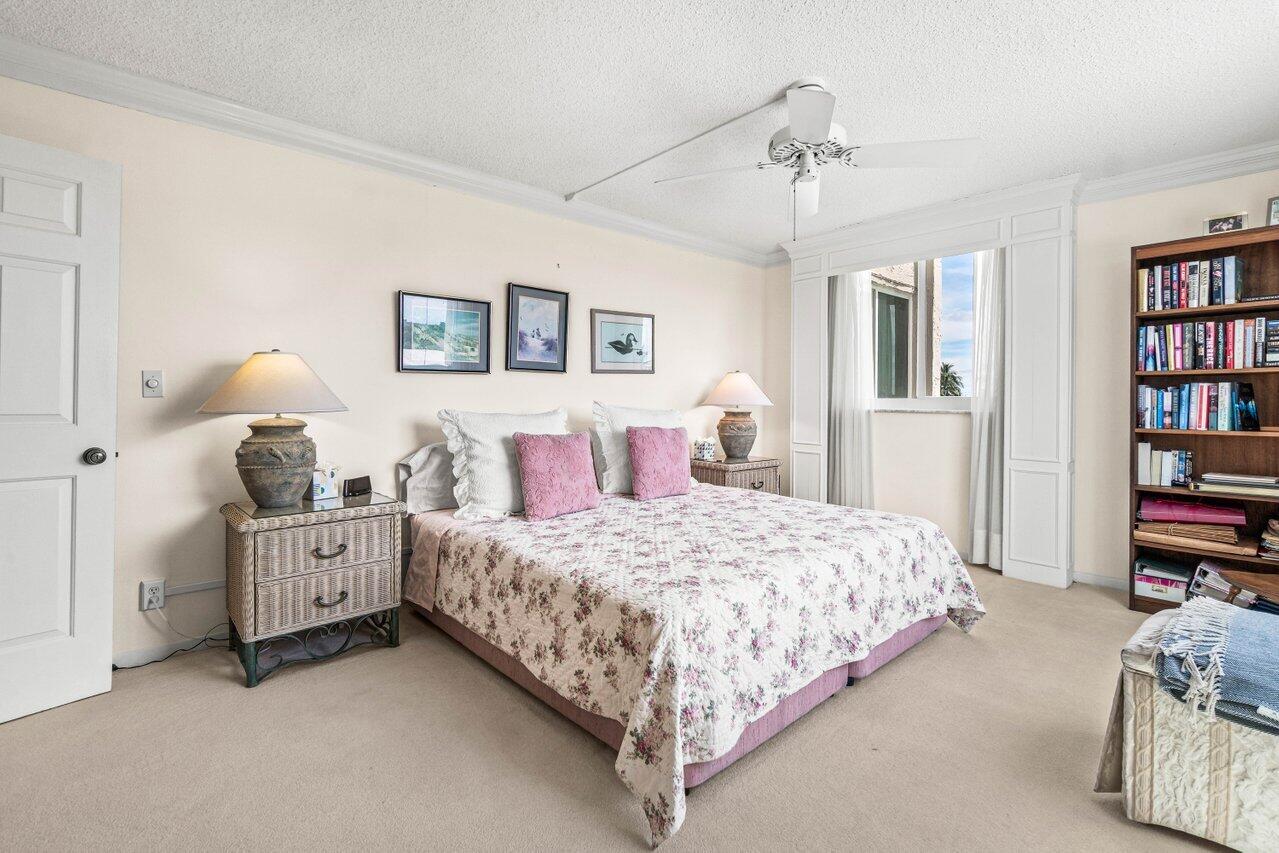 2000 South Ocean Boulevard, Unit 306 Delray Beach, FL 33483 - Photo 23 of 42 a bedroom with a bed and a book shelf